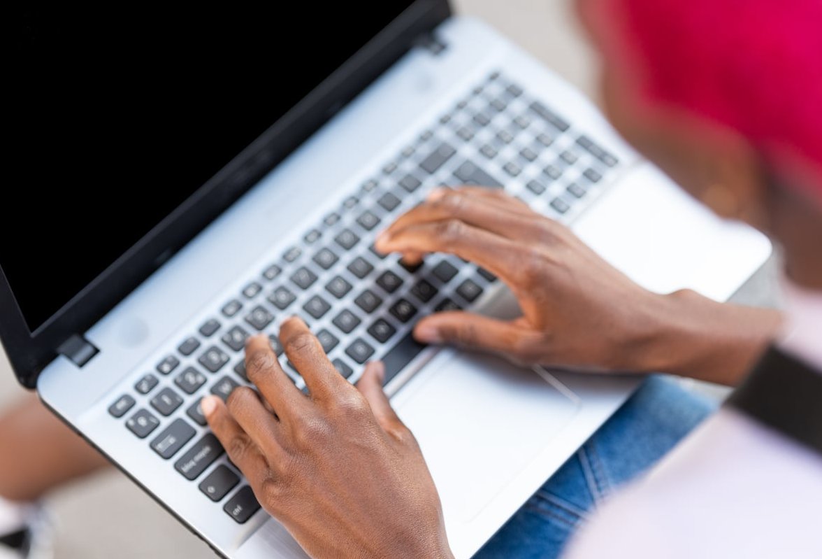 journalist typing laptop
